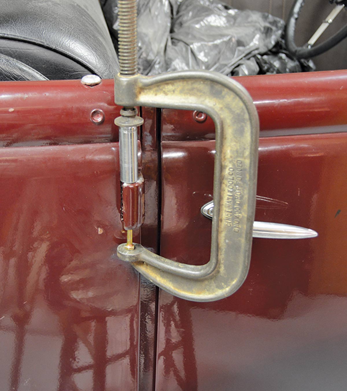 A large C-clamp put the squeeze on the bolt and pin