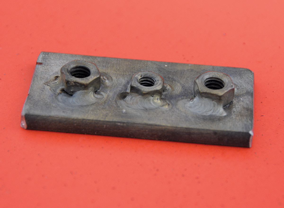 All three nuts were welded to the bottom side of the baseplate