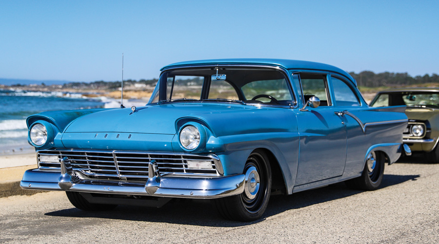 1957 Ford Custom driving along the coast