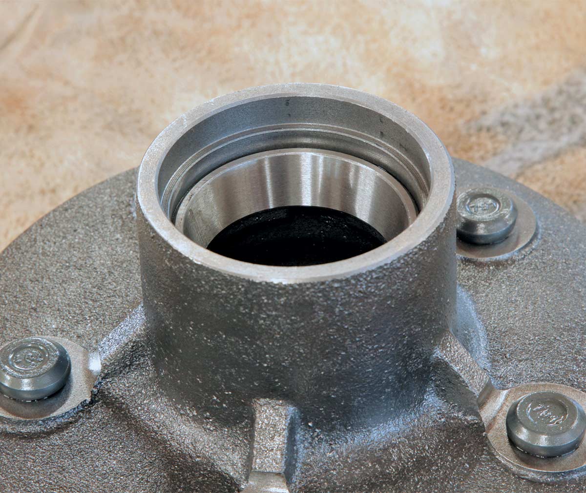 Evenly tapping the bearing race into the 5×5.5 lug pattern wheel hub