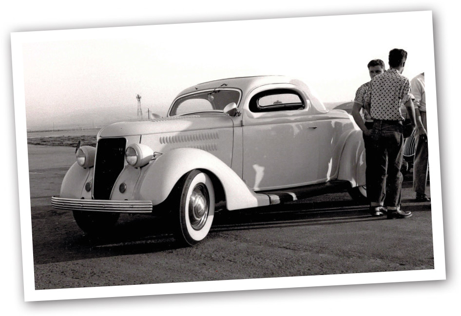 polaroid of the 1936 Coupe and men standing by it