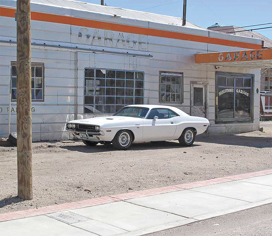 the challenger in front of old buildings in Goldfield