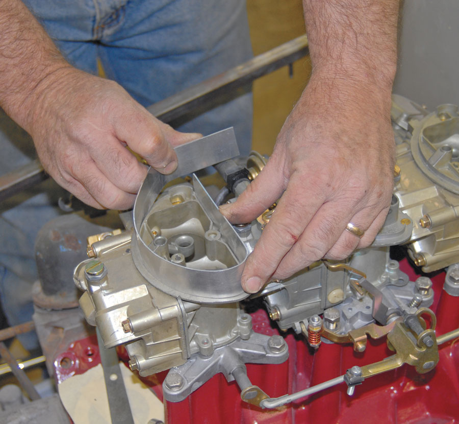 03: Work began by forming 3003-H14 aluminum flat stock to match the shape of the carburetors