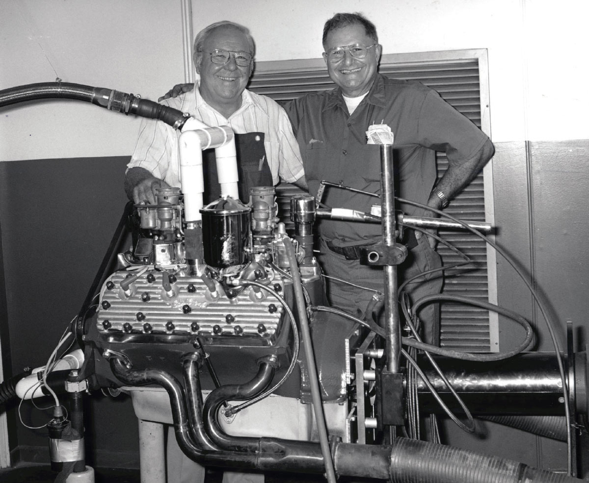 Men next to a engine