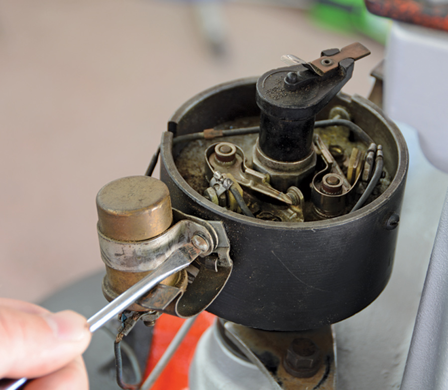 Mechanic removes the condenser from the distributor