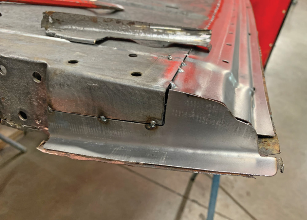 Two tack welds are made to allow bending the patch piece inward or outward for a perfect fit