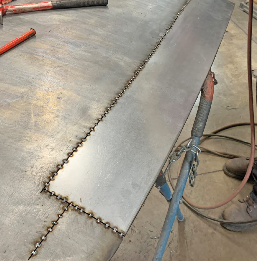 Additional spot welds were made to fill in the gaps, ultimately forming one long weld