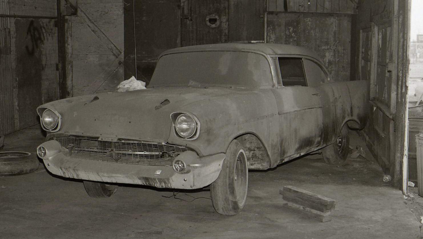Front view of an old Chevy in a garage