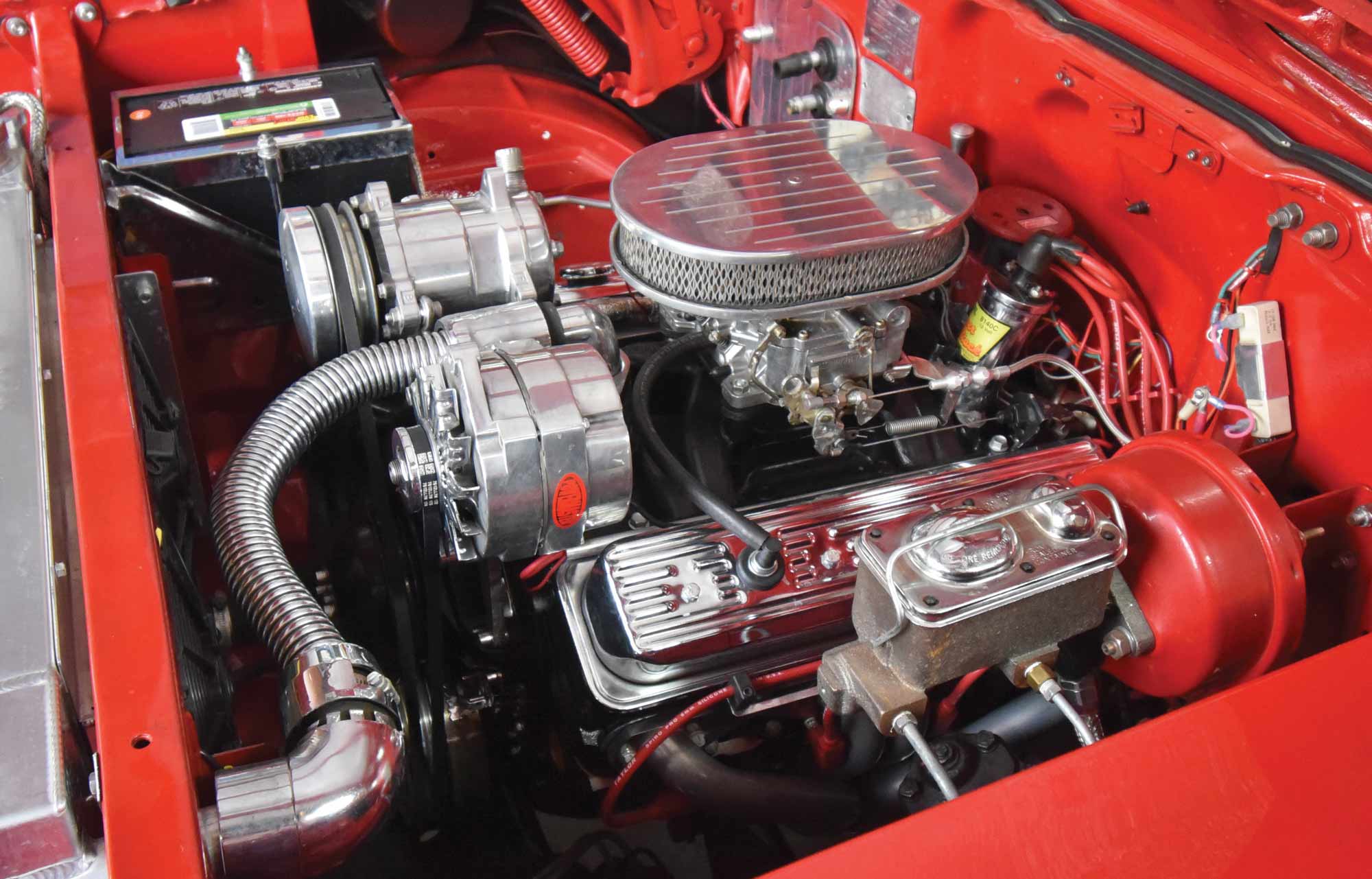 Under the hood of the red car rests a mildly modified Chevrolet 350 crate engine from BluePrint Engines in Kearny, NE
