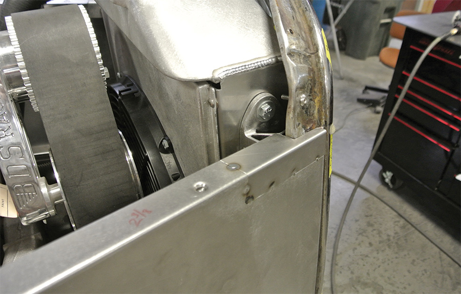 A notched piece fabricated to fit the top front corner of the hood
