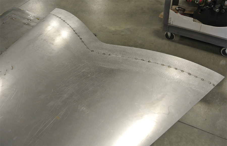filler panel on the rear of the hood fabricated and carefully tack-welded in place