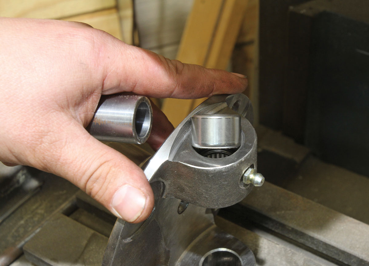 the bottom tall bearing being pressed into service