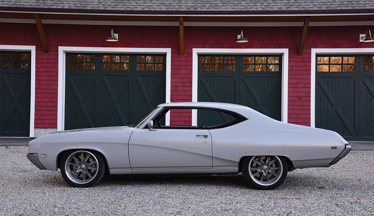 1969 Buick Skylark Sport Coupe side profile with barn styled garages in background