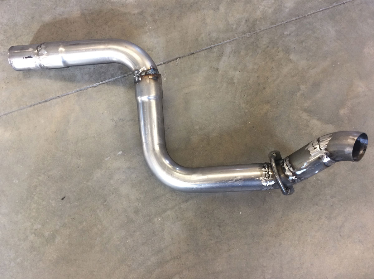 25: Here’s a segment of pipe showing you the kinds of bends that are required to allow the exhaust tubing to pass by and around all of the underbody obstacles