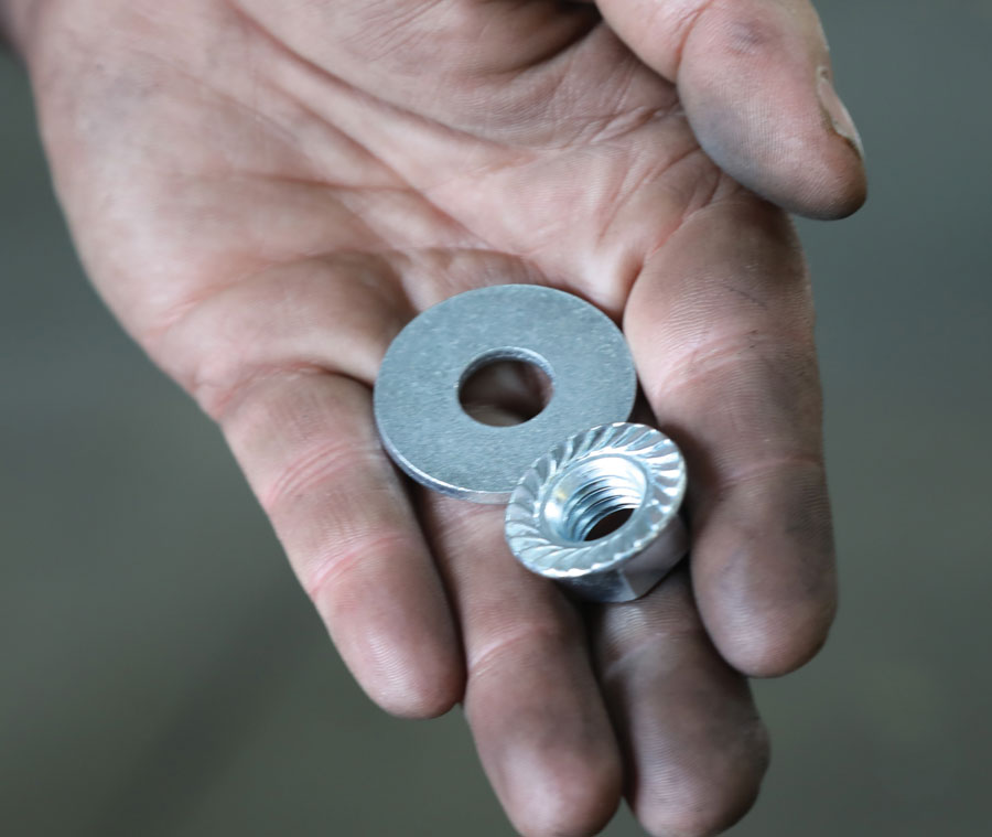 26: Hardware for the upper mounts include a serrated nut and a thick, large-diameter washer