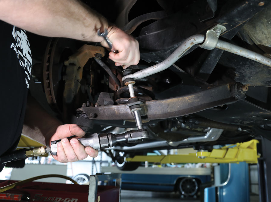 5: Removing the antiroll bar links will allow the lower control arms to swing down far enough to remove the springs