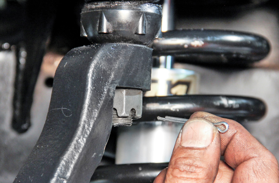tighten the upper and lower ball joints with the cotter pins