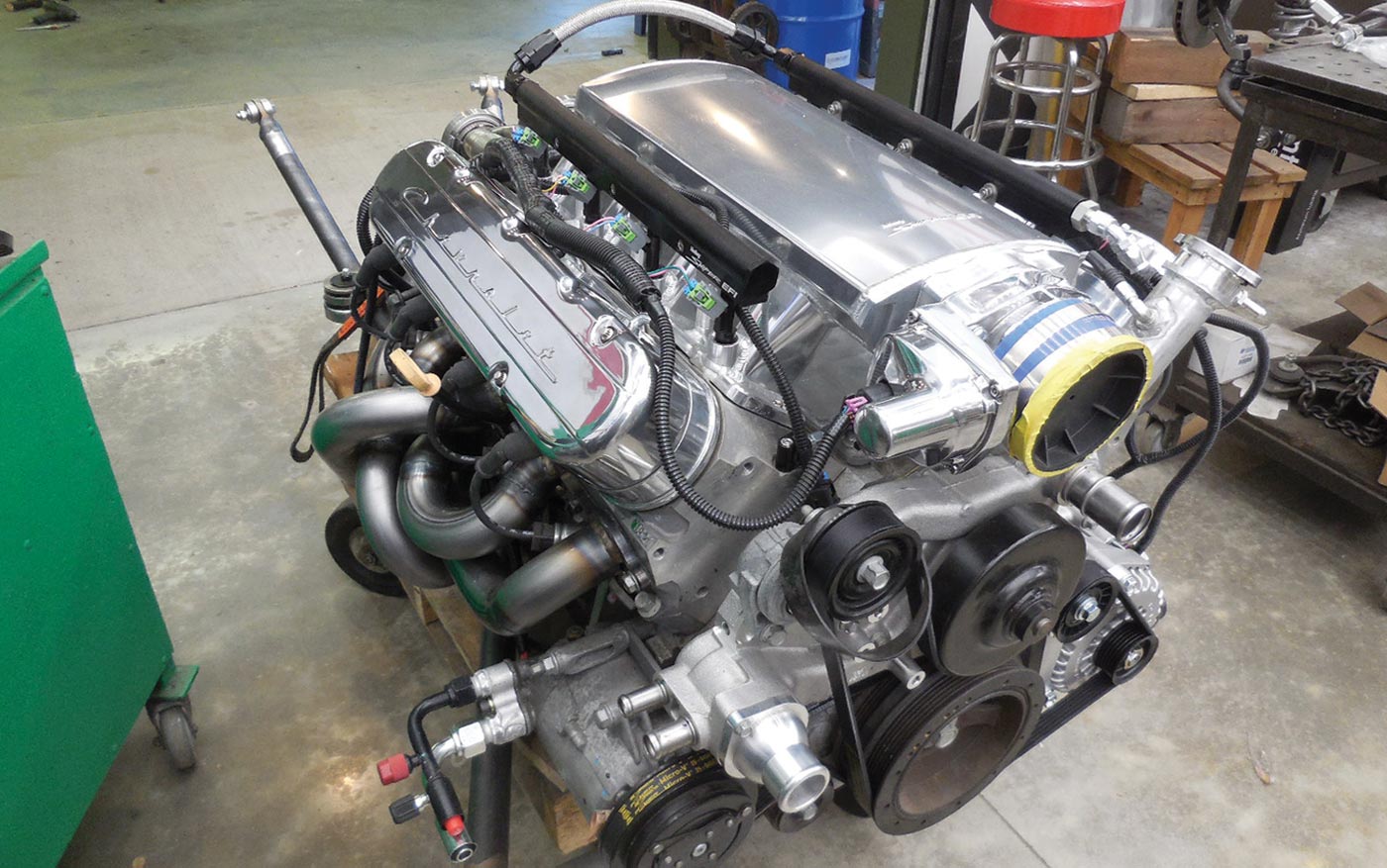 the LS3 with a Holley Sniper intake and their vintage-style valve cov- ers along with a Comp Cams camshaft and kit