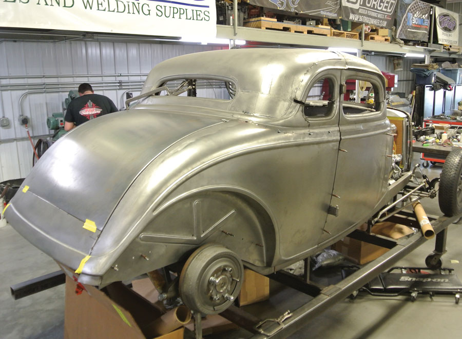Here we see the final fit of the passenger side quarter-panel. The rear center panel fits the lower rear corner of the quarter-panel perfectly and the fit of the new SAR quarter-panel to the original coupe metal below the windows is also perfect.