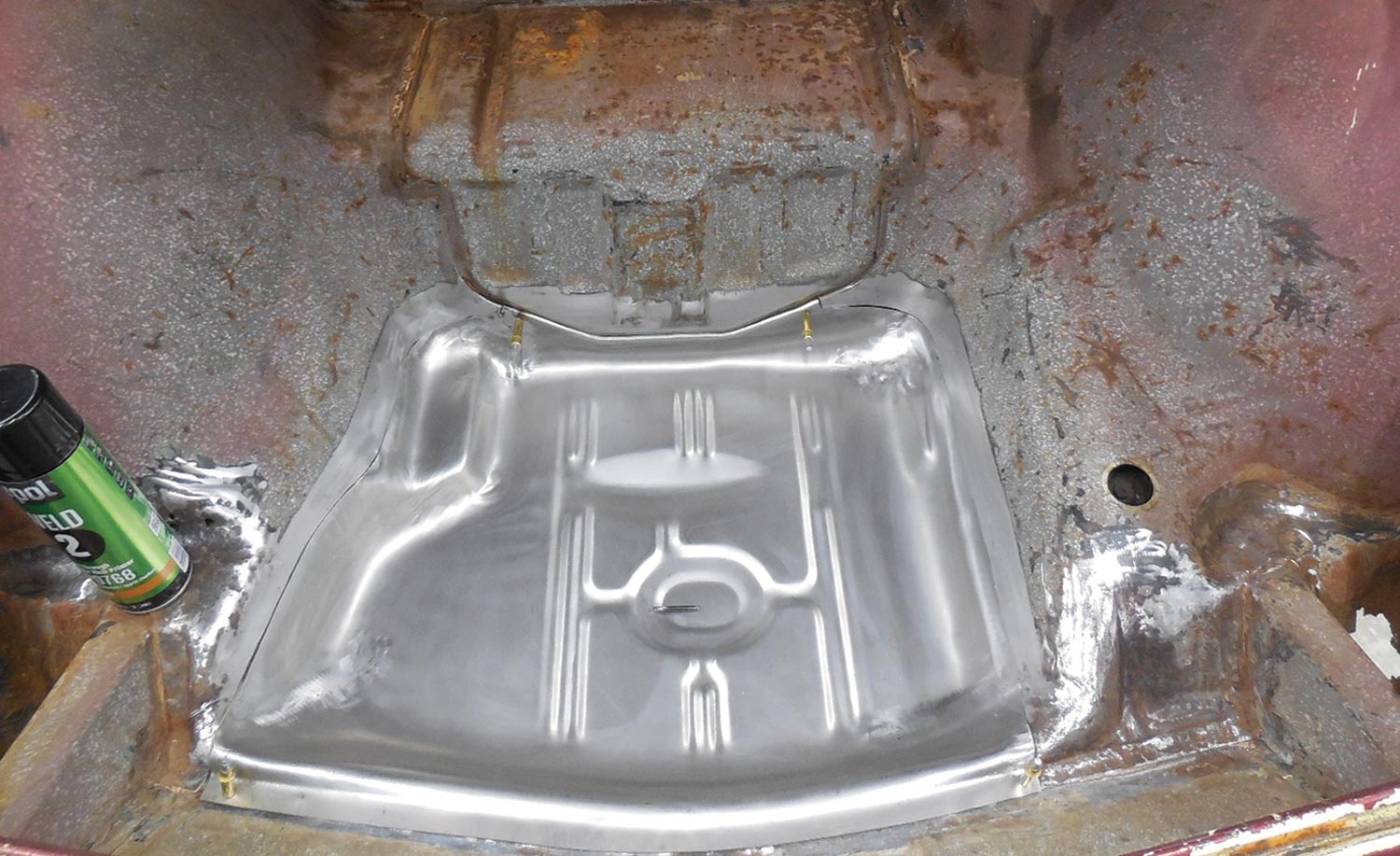 Corvair trunk floor that received a new stamped steel replacement