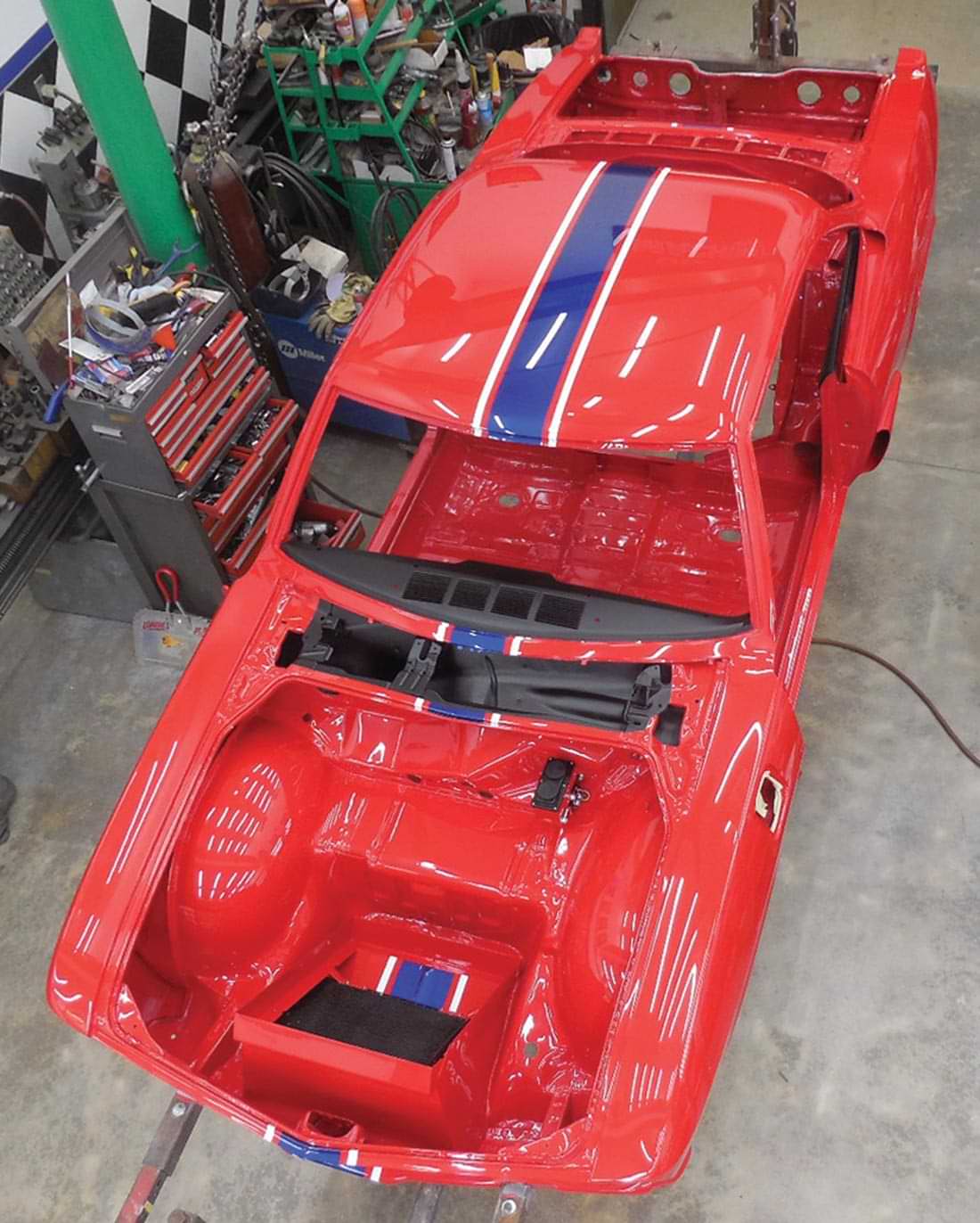 top view of the RareVair body with a completed paint job of Pull Me Over Red, and a blue stripe