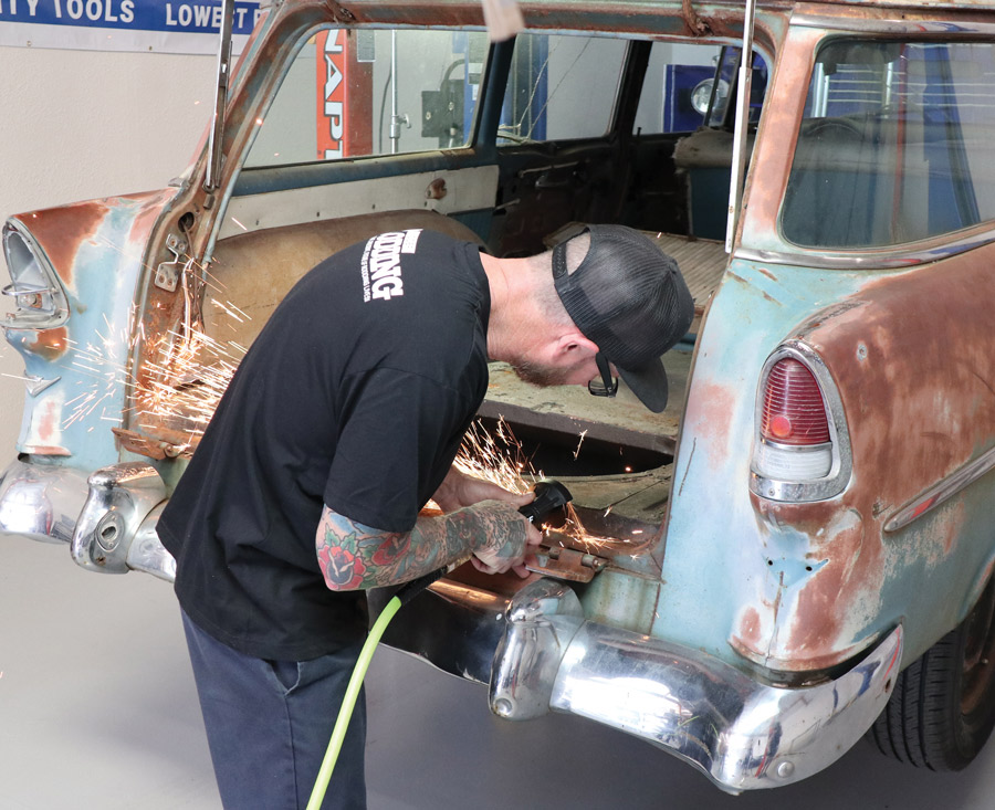 Jason Scudellari, working at the In The Garage Media Tech Center, begins the process of swapping out the rusty tailgate on our ’55 Chevy wagon for a fresh one from Golden Star Classic Auto Parts along with the required accessory items and hardware from Danchuk (the Tri-Five people).  