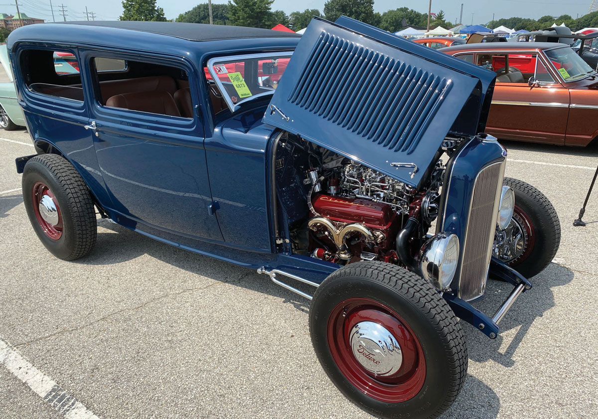 Blue classic hot rod with open hood