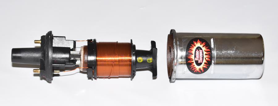 Here the internals of an ignition coil has been removed from its canister. The canister is normally filled with oil or Epoxy (for high-vibration applications) to act as an insulator and prevent contamination from moisture. 