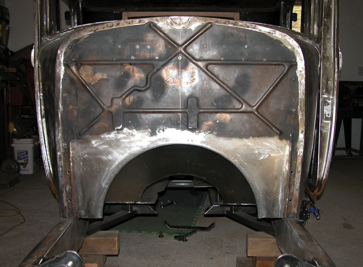 The final firewall now shows holes filled, the trans tunnel fully fabricated, and ready for the next step