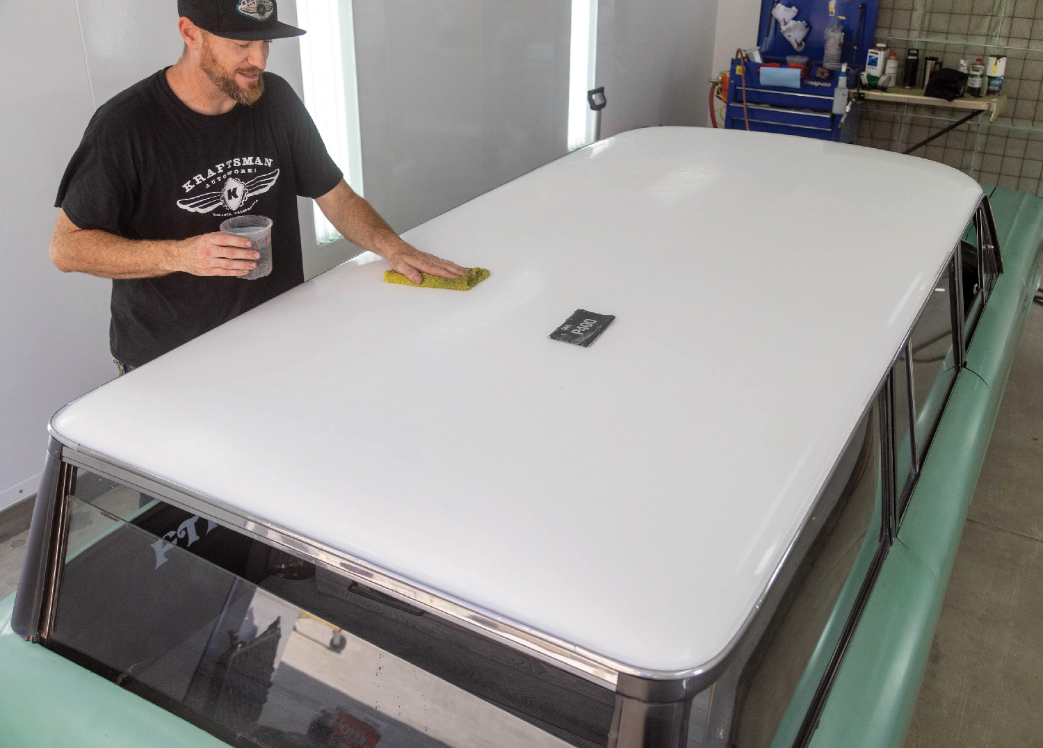 Jack Fields of Kraftsman Autoworks in Torrance, CA, is making sure the surface (in our case the roof) is free of any dirt or other particles.