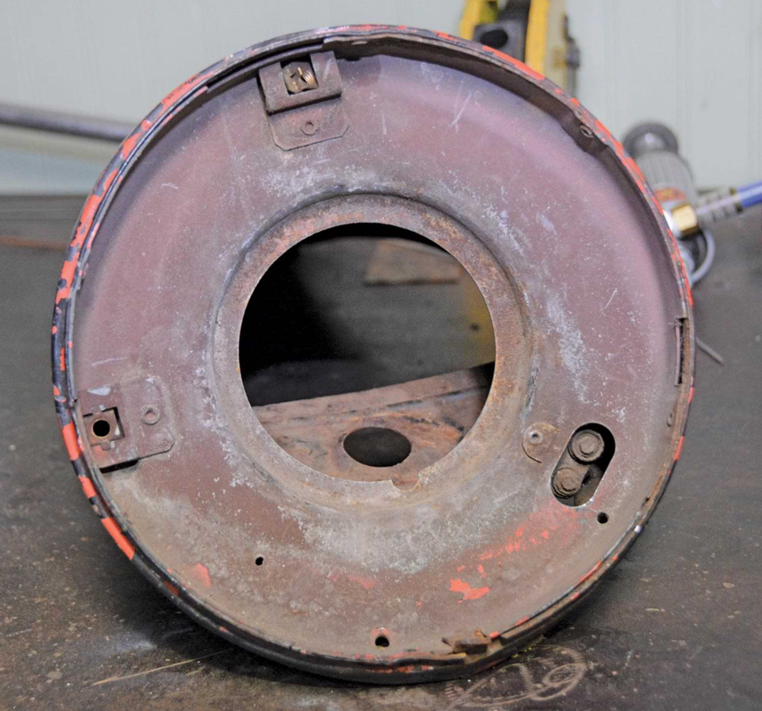 view of a rusted headlight housing part 
