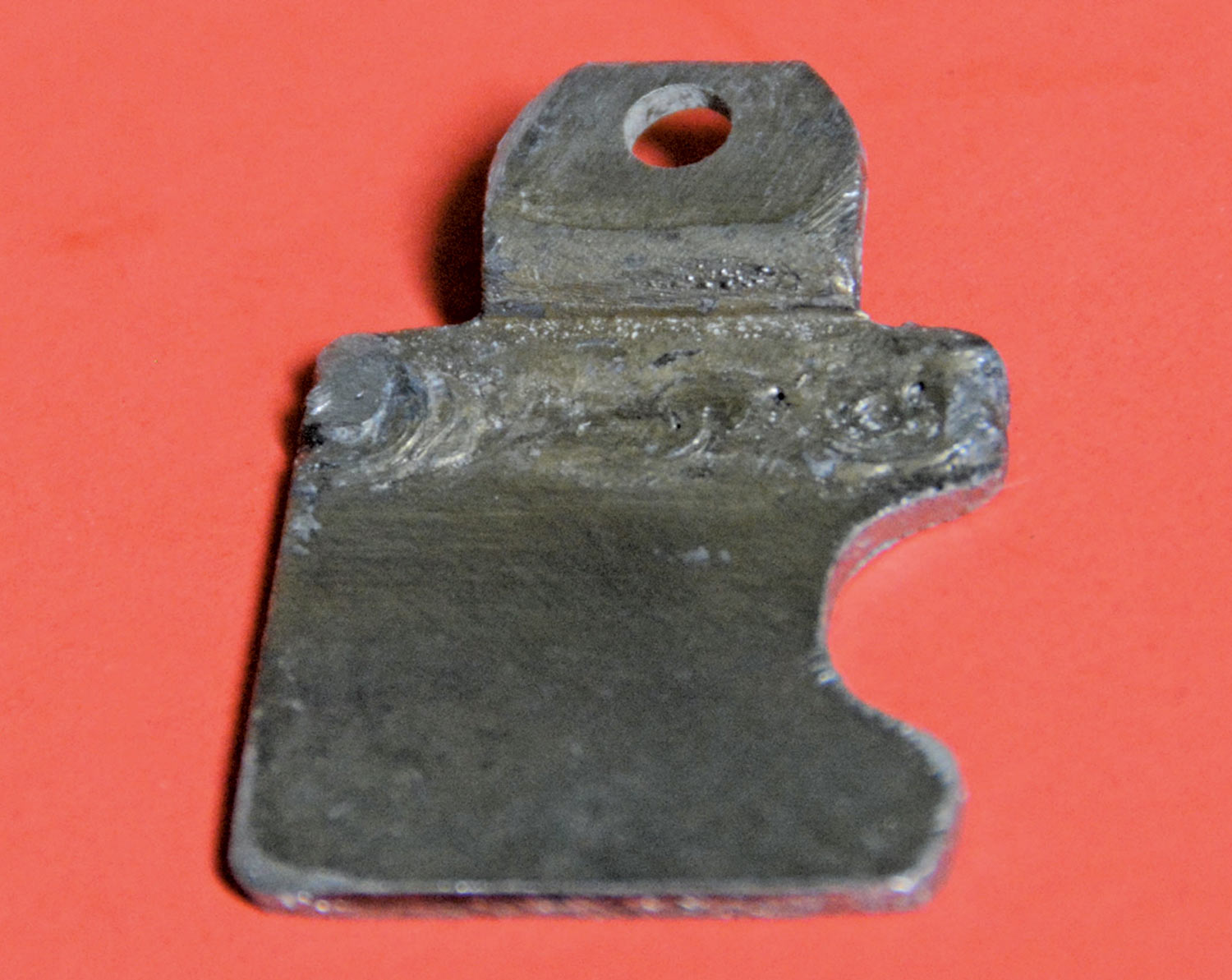 view of a piece of 1/8-inch flat stock with a C-shaped relief