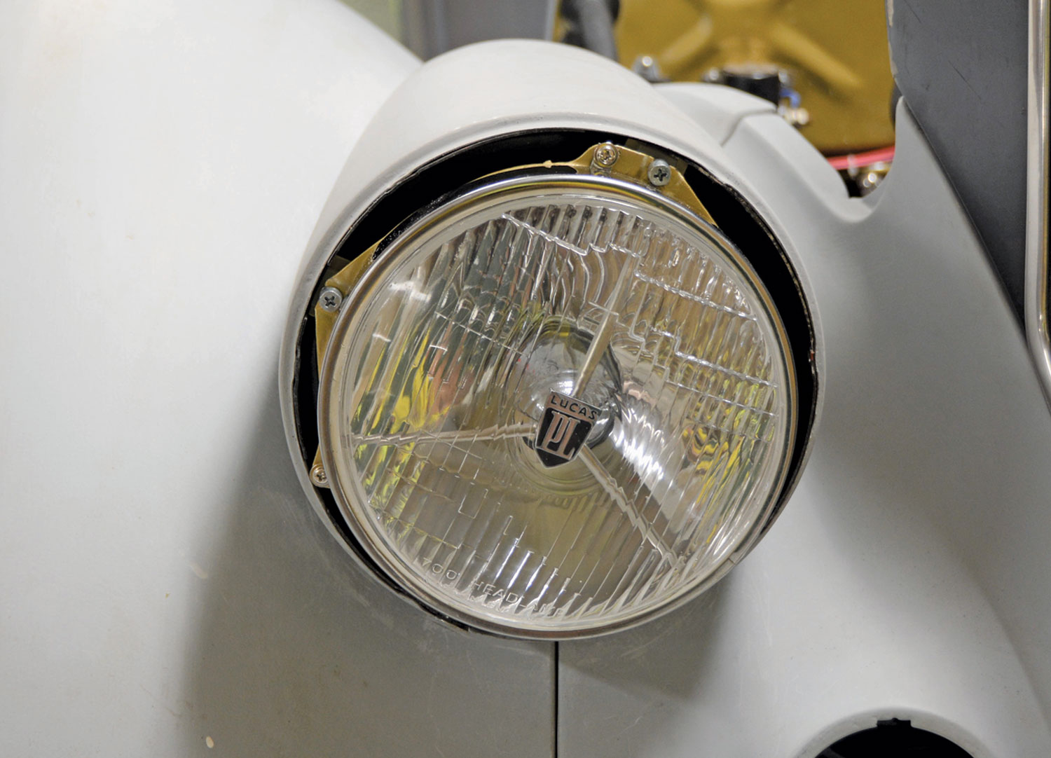 view of the new Lucas PL lights mounted and bolted to the fender