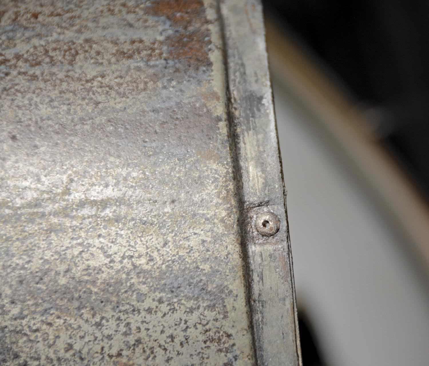 close view of a headless rivet on the light