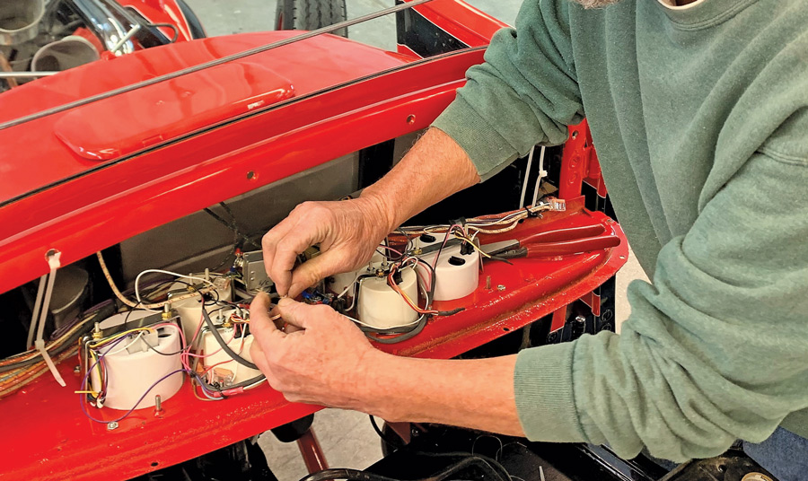 Colin puts the finishing touch on wiring the Classic Series gauges. One of the critical aspects for the proper operation of these instruments is a good ground to clean, bare metal.