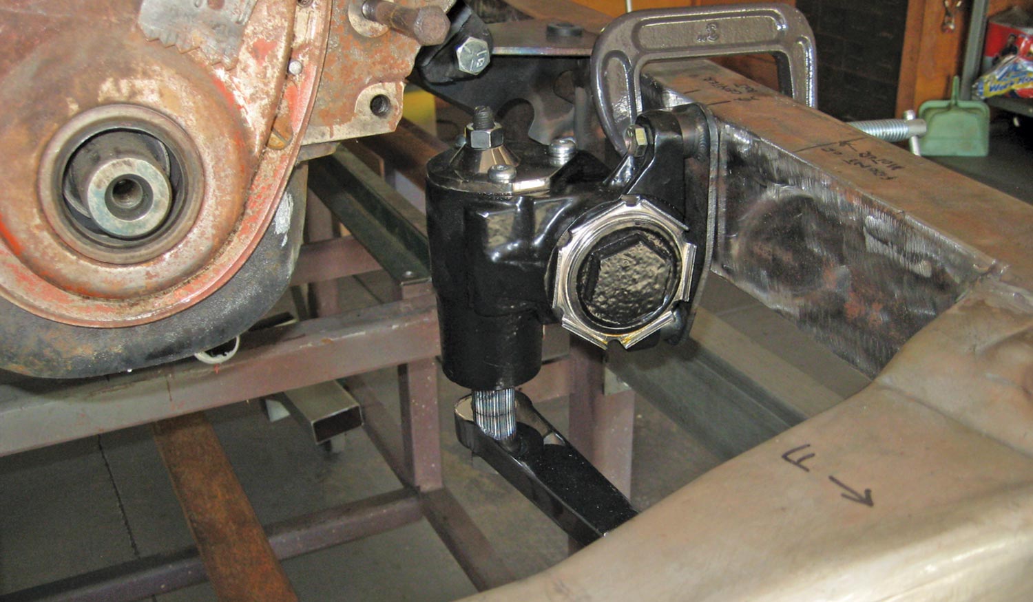 the Flaming River, Vega-style steering box is located forward of the motor mounts with a Deuce Factory bracket