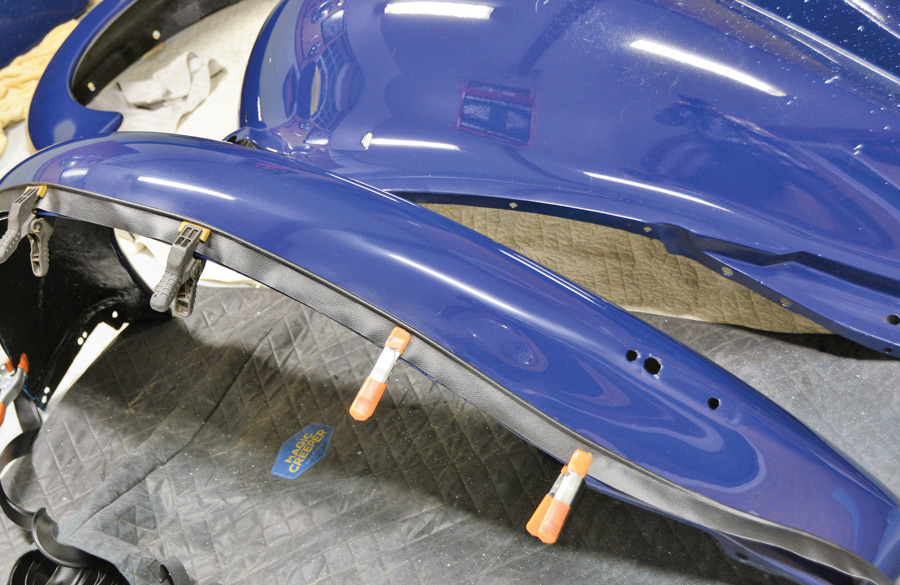 Fender welting was clamped to the fender and the mounting holes were marked. Leave extra welting on both ends and trim to fit the ends after the fender is mounted to the body.