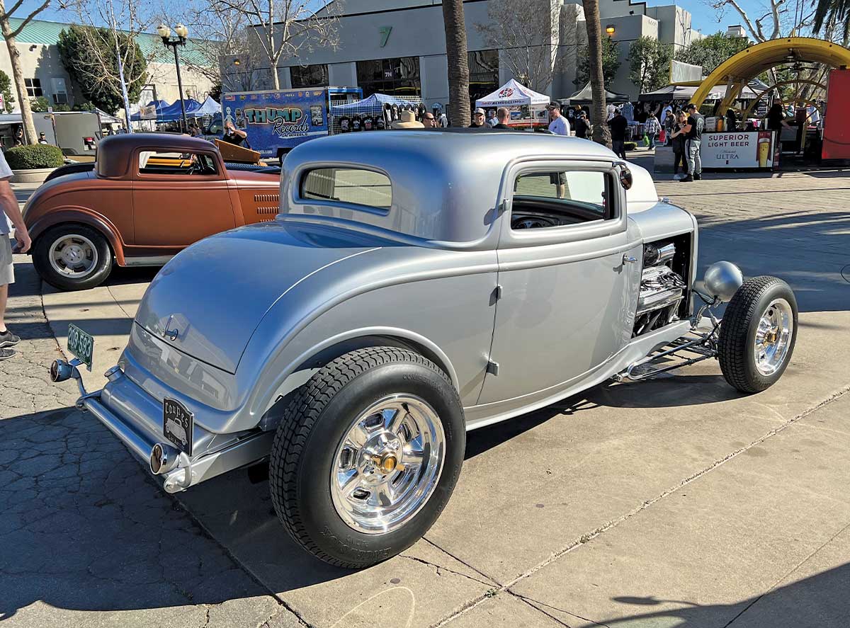 A silver hot rod painted by Mick's Paint side profile
