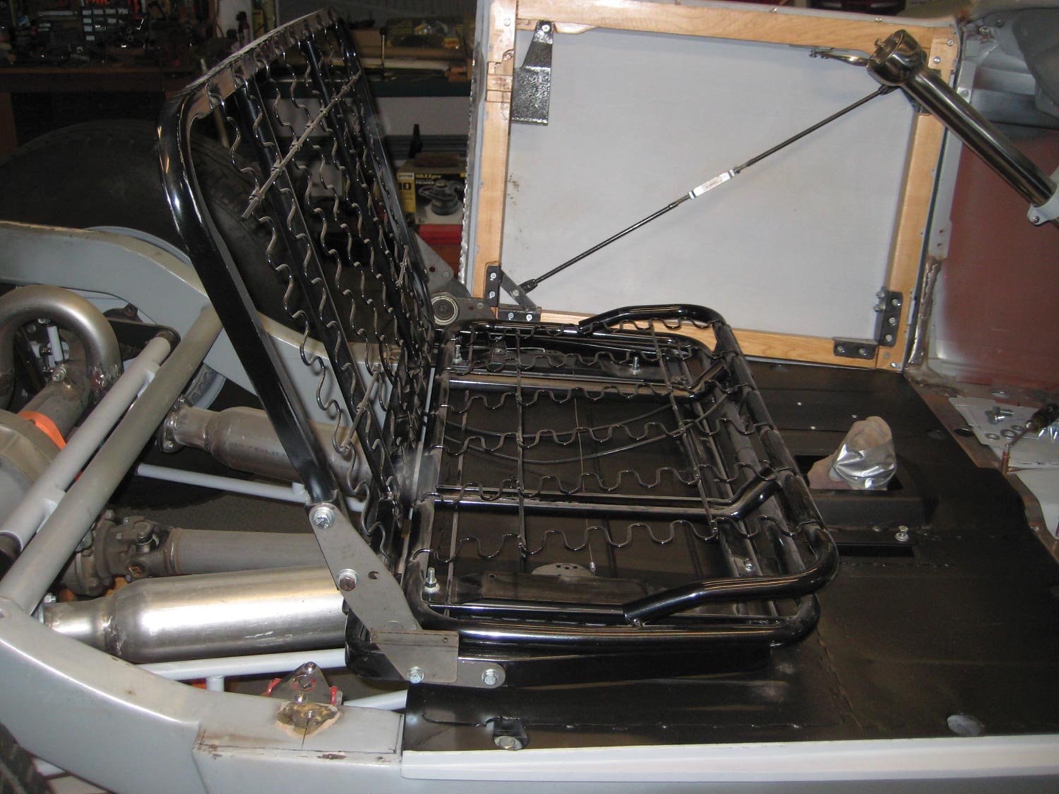 the seat frame is placed on the floor section of the body