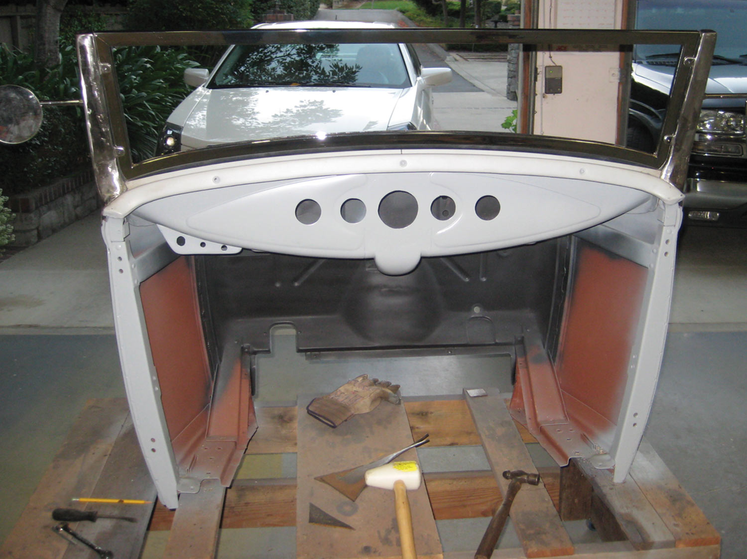 the dash/tank installed on the car covered with a coat of primer