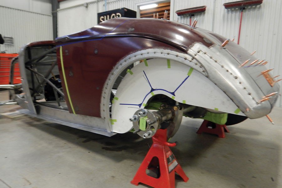 The rear portion of the body was completely reconstructed. The wheelwell openings were sized to work with the tires. Note the layout for the OEM-style beads that will be placed on the inner wheelwell panels.