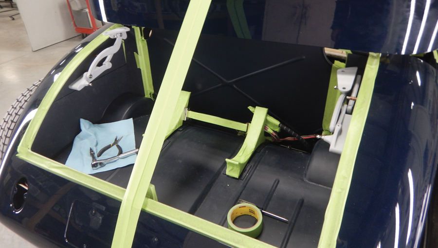 Here you can see how the convertible top cover hinges up. The robust hinges for the decklid can be seen here too, done with the same attention to detail as the rest of the project.