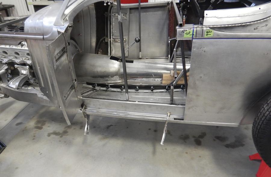 A new floor was made to follow the flowing shapes of the chassis. The transmission and driveshaft covers are being fitted here.