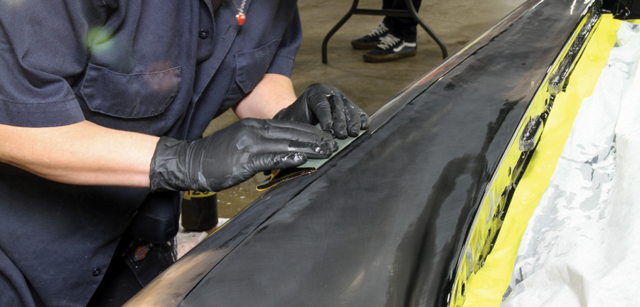 As work continues, the distinct peak on the fender is left for the moment untouched. Areas such as this is where the paint is more susceptible to damage, so more care must be taken to prevent sanding through them. 