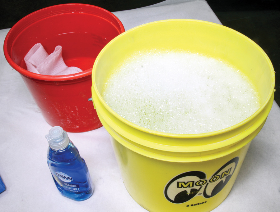A bucket of soapy water is also required for the sandpaper. A moderate amount of soap will help keep the sanding surface well lubricated. It’s also important to rinse and refill the bucket with new soapy water when moving up to the next stage of sanding, i.e., moving from 2,000- to 3,000-grit. 