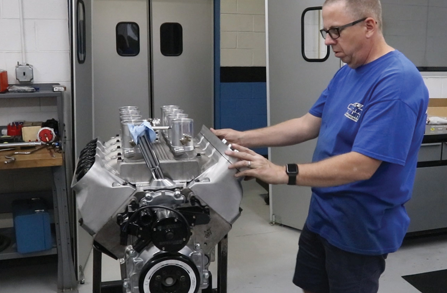 mechanic Jeff installs an electric water pump for the dyno pulls then begins assembling the rocker covers and ignition system