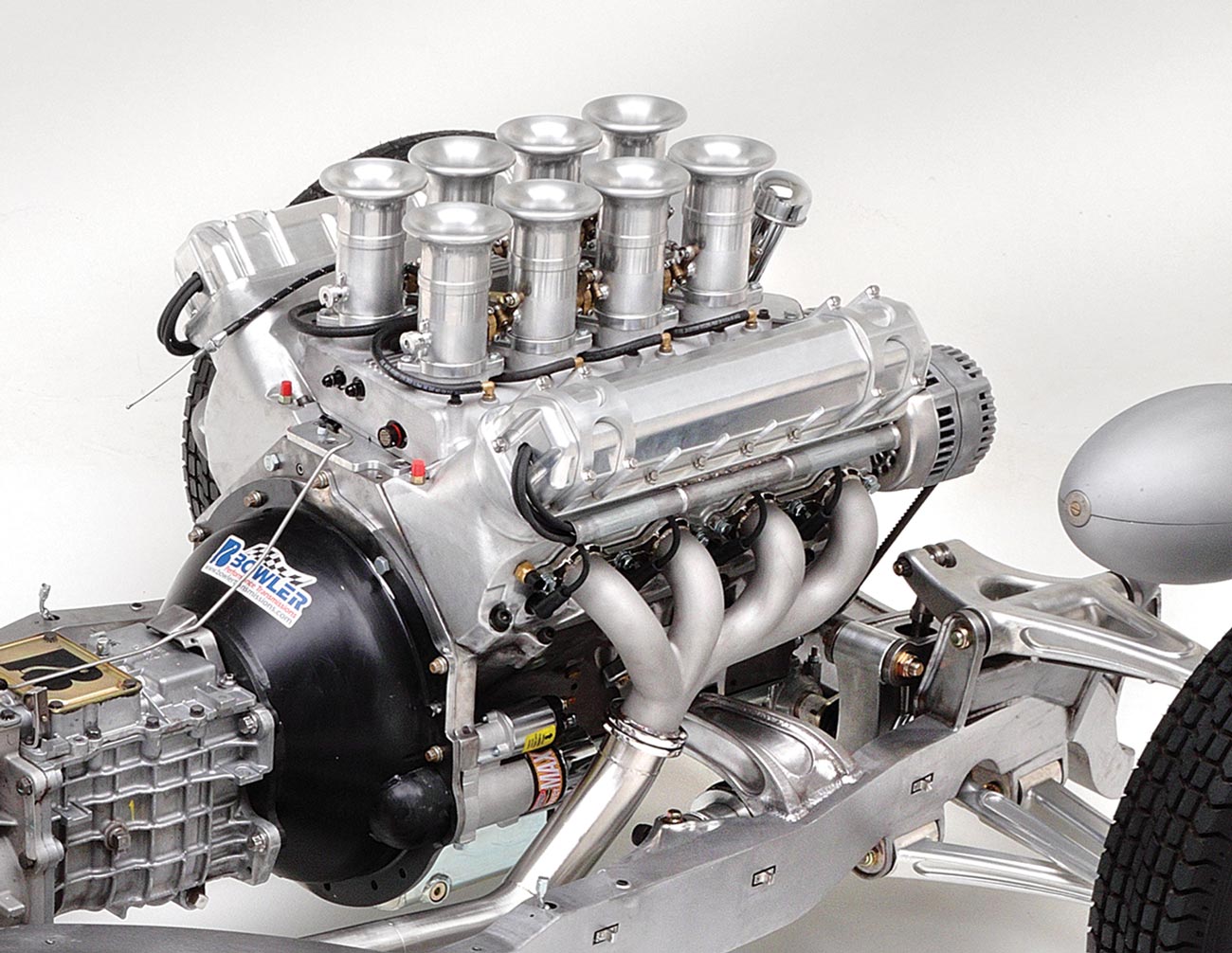 the engine dropped between the Roadster Shop framerails, featuring DRC designed headers that were built by Performance Welding Solutions to have the look of manifolds and JHRS produced stainless steel exhaust clamps