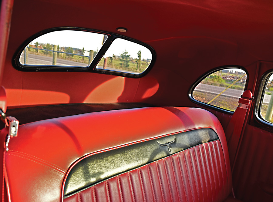 close up of the red and black leather interior in a '39 Ford DeLuxe Coupe