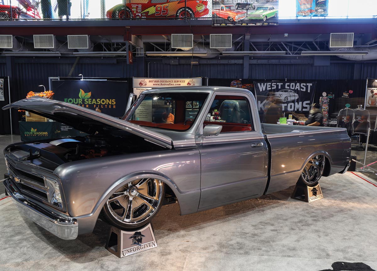 quarter front view of a slate grey ’69 Chevy C10 on blocks
