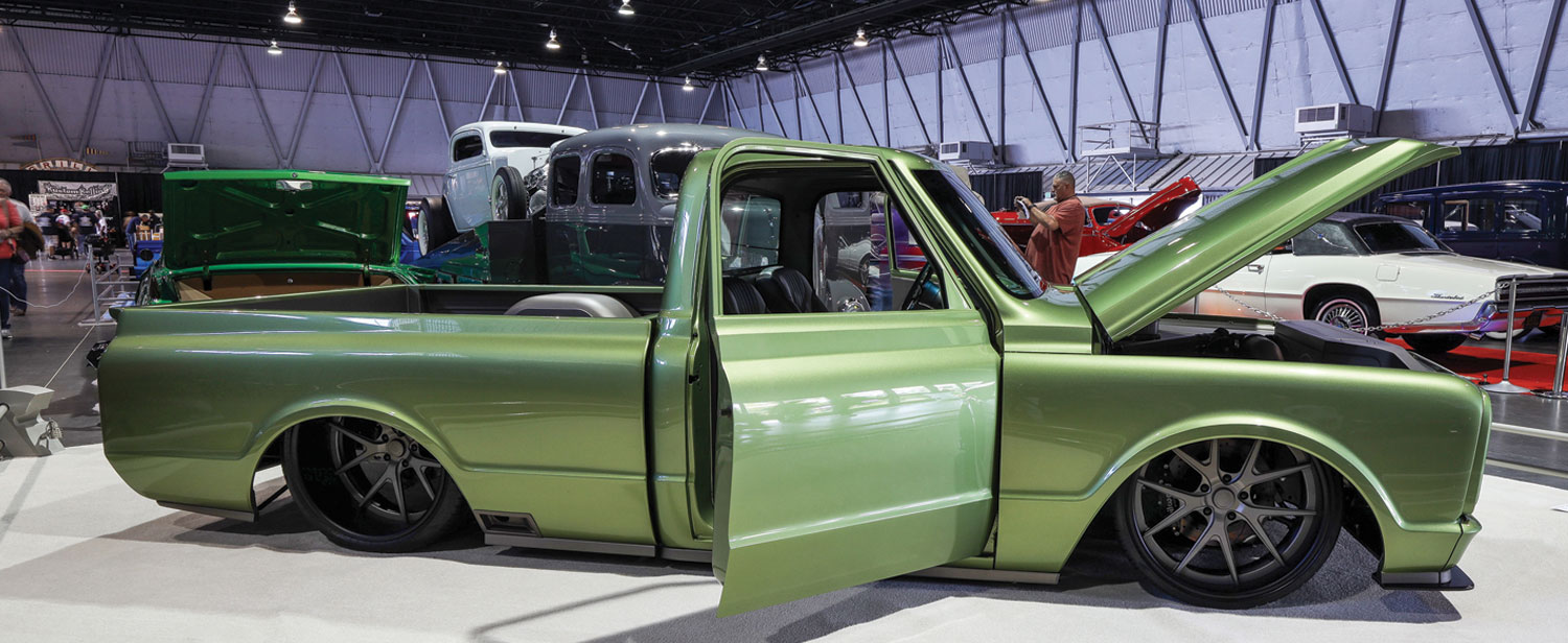 passenger side view of a muted metallic lime green ’70 Chevy C10